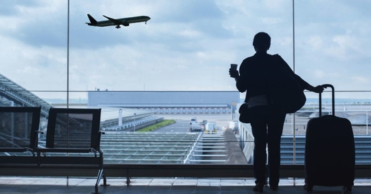 person watching air plane take off